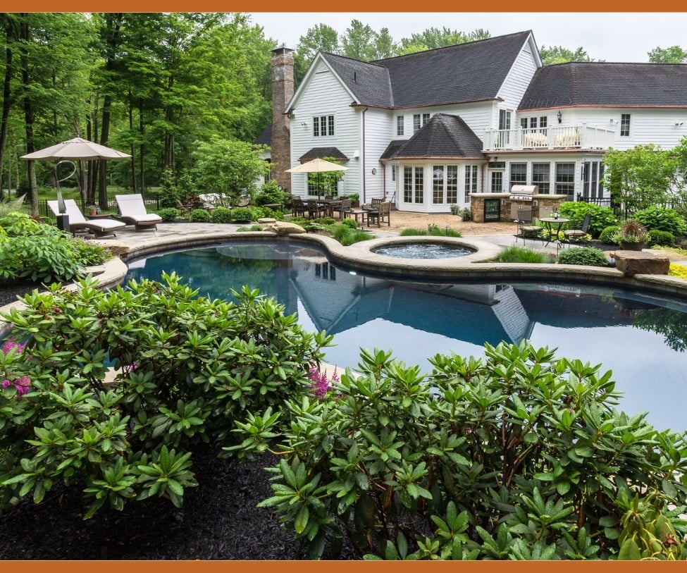 A luxury backyard with an inground pool and outdoor kitchen-1