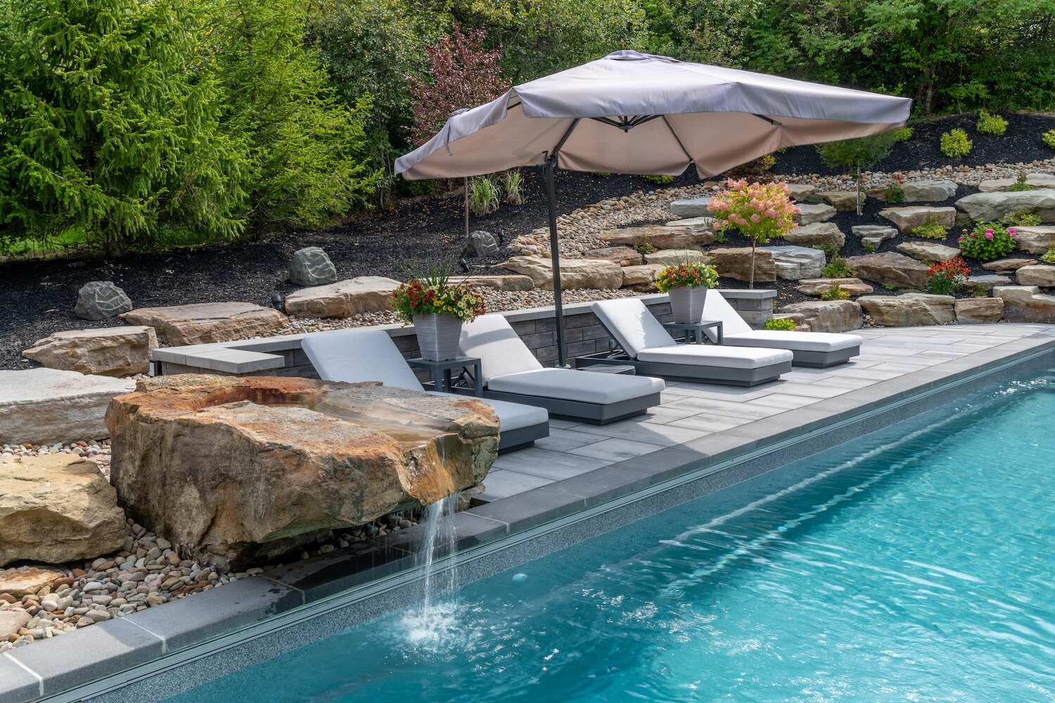 Backyard fountain in Chagrin Falls, OH enhancing landscape design with bubbling water.