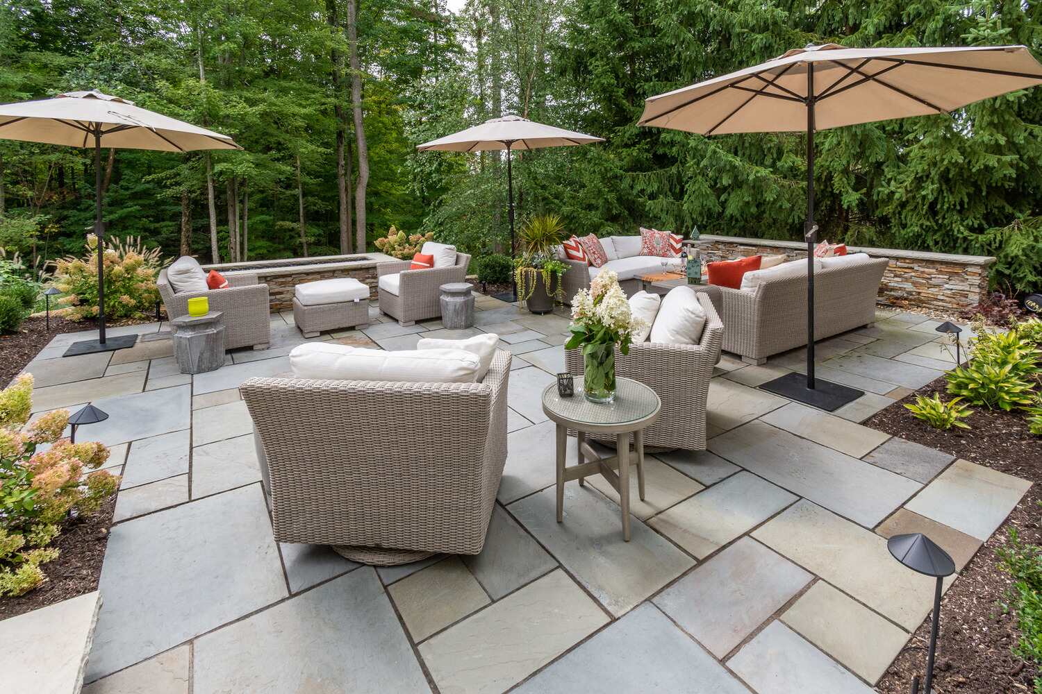 Luxury landscape design in Chagrin Falls, OH with custom stone patio and Fire Pit
