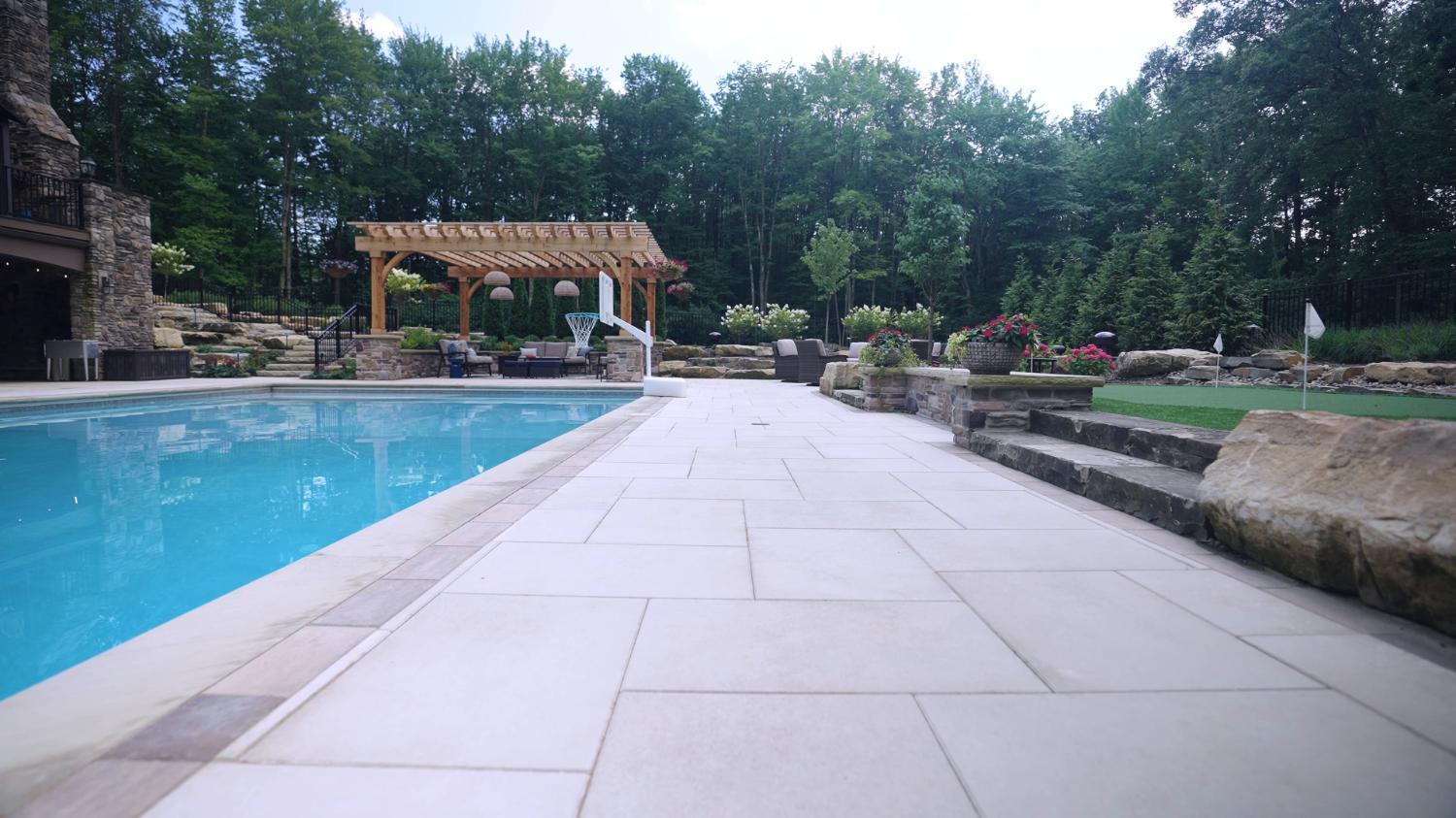 Custom stone fire feature designed for outdoor entertaining in Northeast Ohio