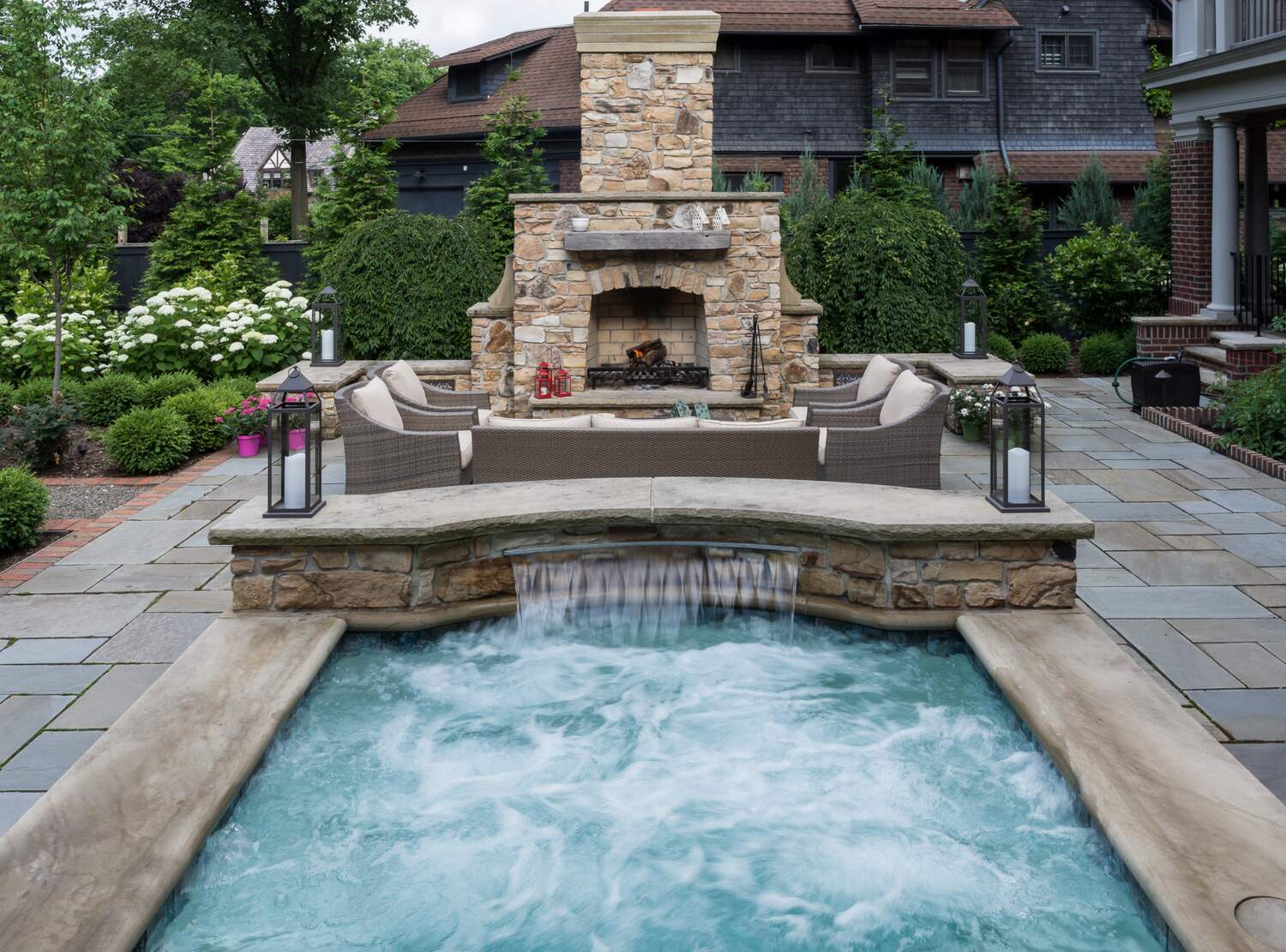 Custom-built outdoor fireplace in Moreland Hills, OH for a stylish and inviting backyard retreat.
