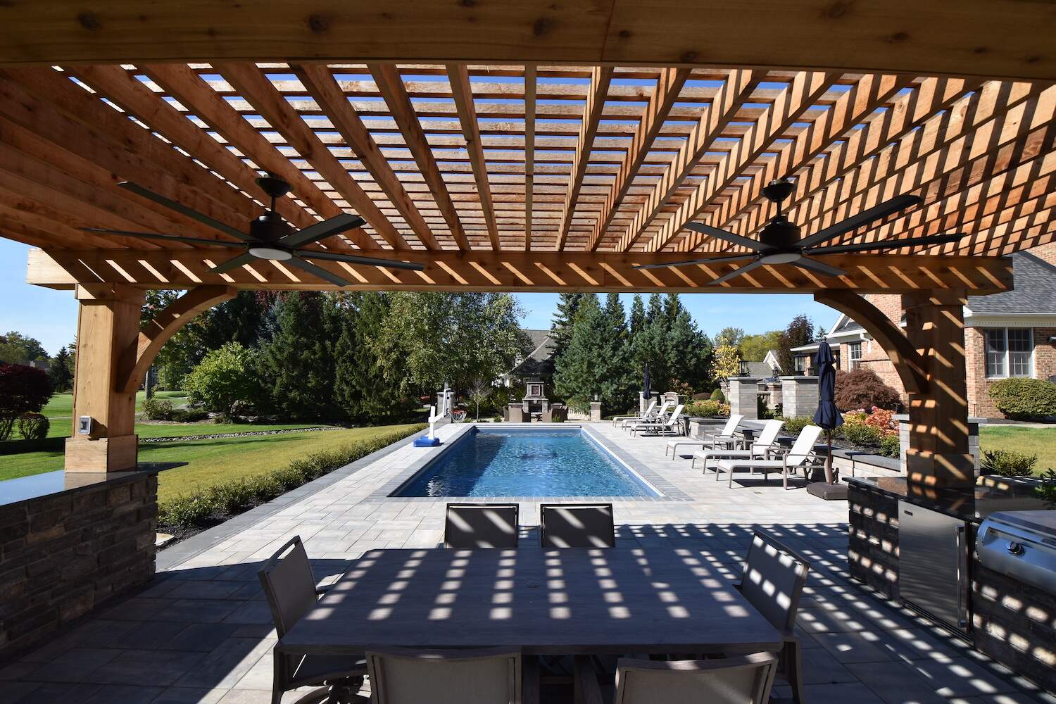 Custom-built pergola in Orange, OH providing stylish sun protection over a patio
