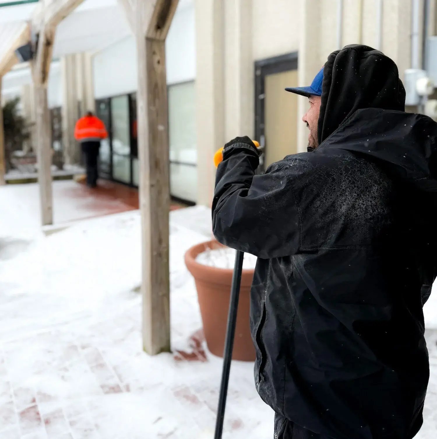 Exscape Designs crew applying ice melt for pedestrian safety in Moreland Hills, OH