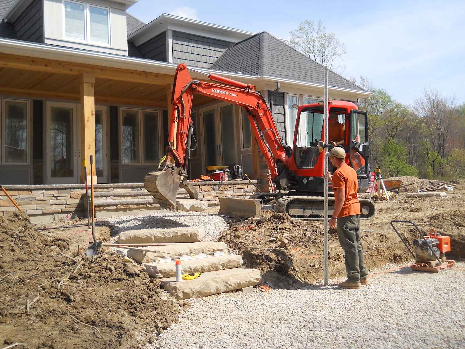 Exscape Designs employees collaborating on a landscape project in Beachwood, OH