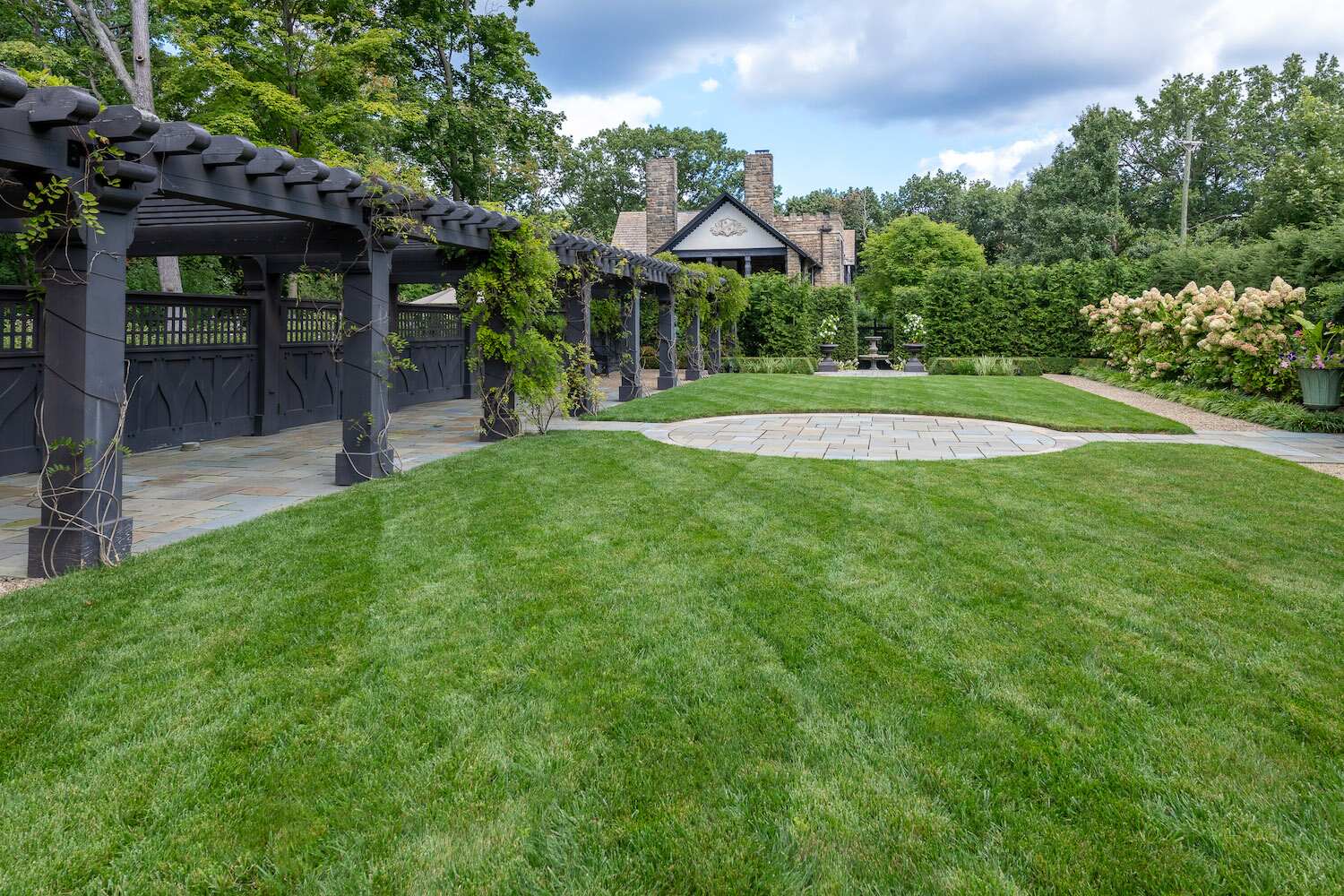 Lush, well-manicured lawn in Bainbridge, OH maintained with expert fertilization services