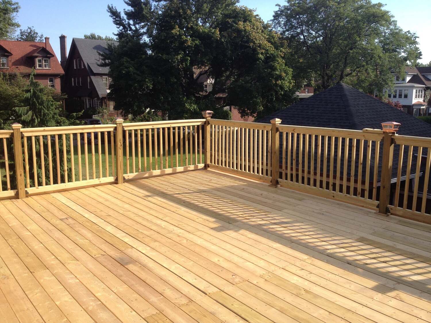 Modern backyard deck with seating area in Painesville, OH