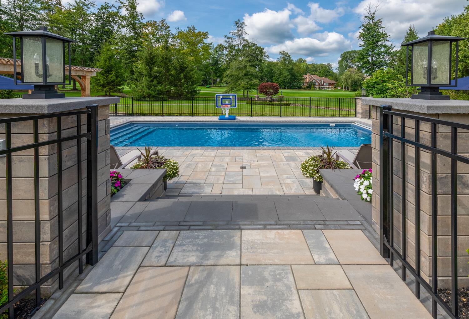 Flowering shrubs and vibrant seasonal blooms enhancing an outdoor living space in Orange, OH
