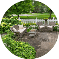 flower beds next to patio seating