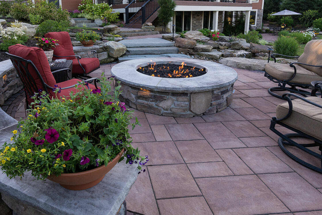 Lush flowering plants and greenery framing a serene lakefront view in Chagrin Falls, OH (1)