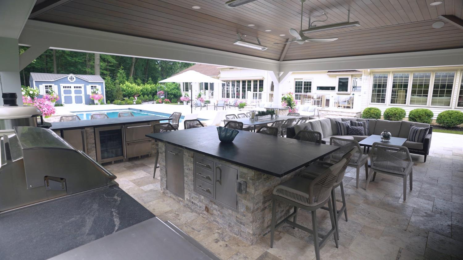 Luxury outdoor kitchen and bar designed for entertaining in Highland Heights, Ohio