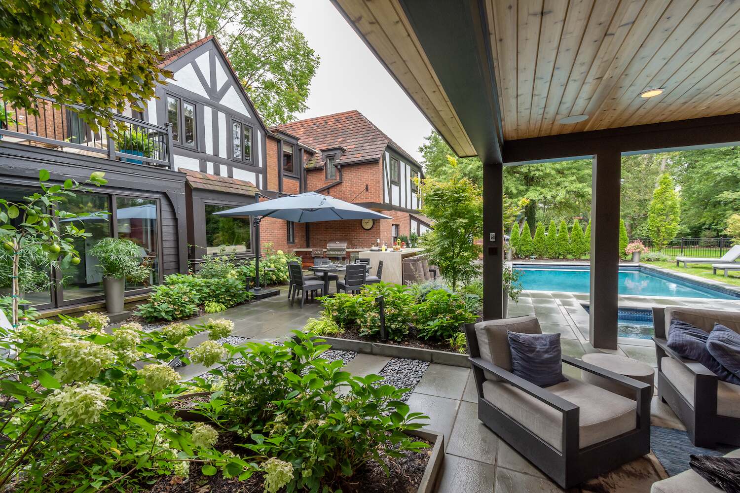 Luxury outdoor kitchen with a built-in bar and sleek countertops in Moreland Hills, OH