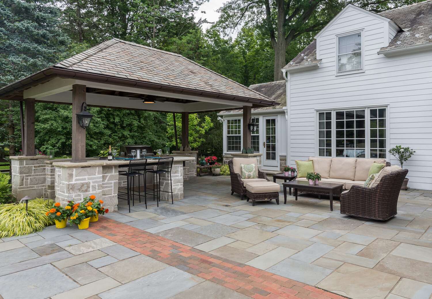 Luxury paver patio with built-in seating in Bainbridge, OH