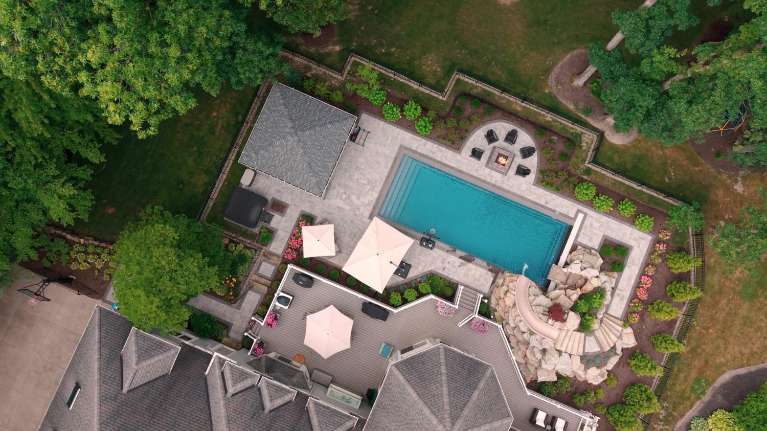 Modern outdoor living space centered around a fiberglass pool in Ohio