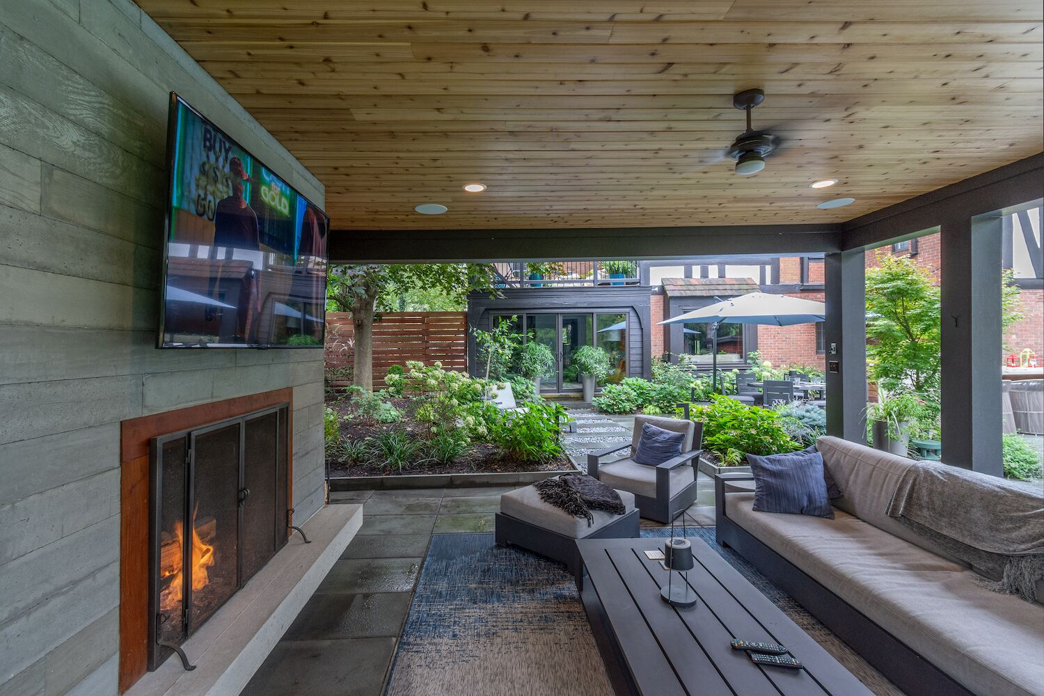 Modern outdoor pavilion featuring a built-in fireplace and TV in Bainbridge, OH (1)