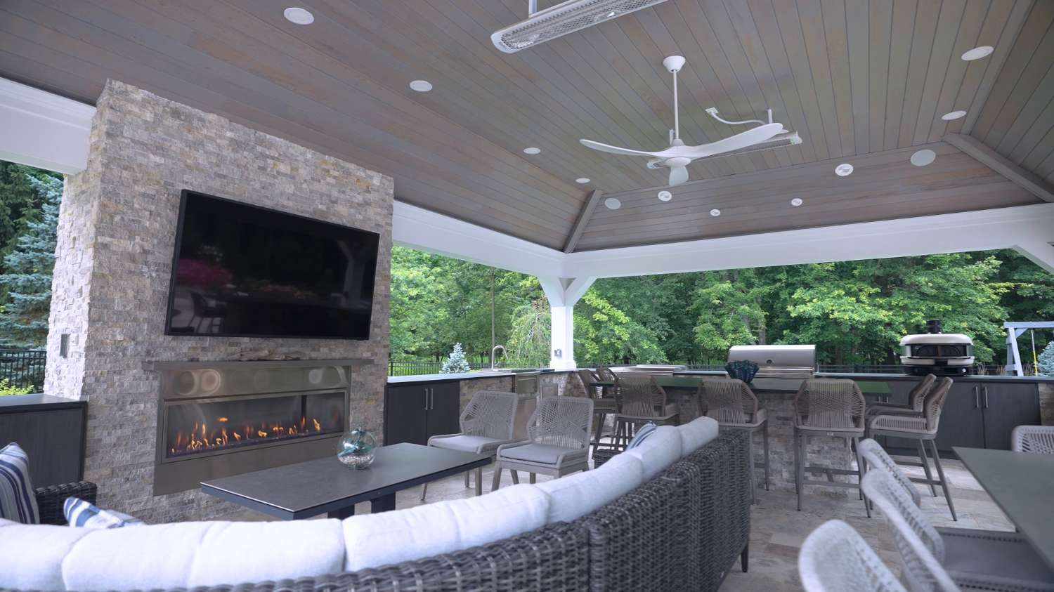 Modern outdoor pavilion featuring a built-in fireplace and TV in Bainbridge, OH-1