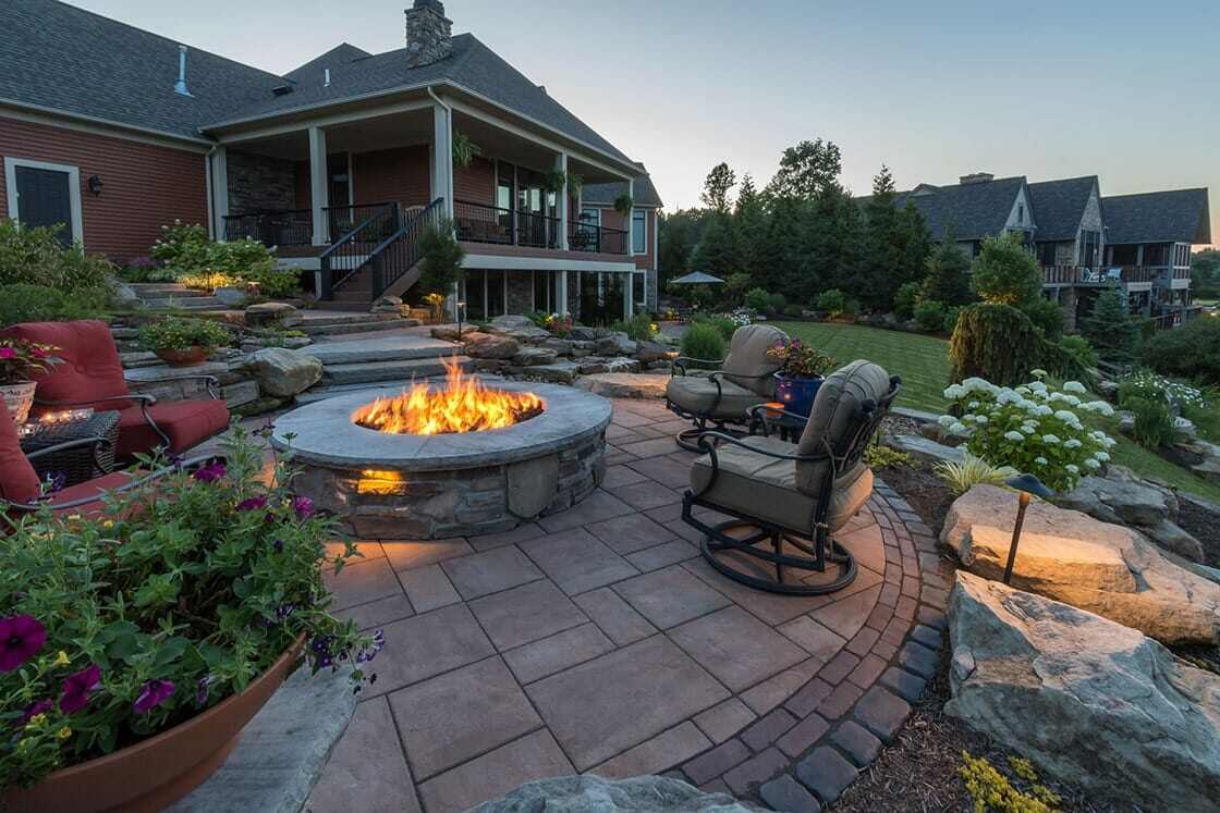 Outdoor entertaining space with scenic water views in Chagrin Falls, OH
